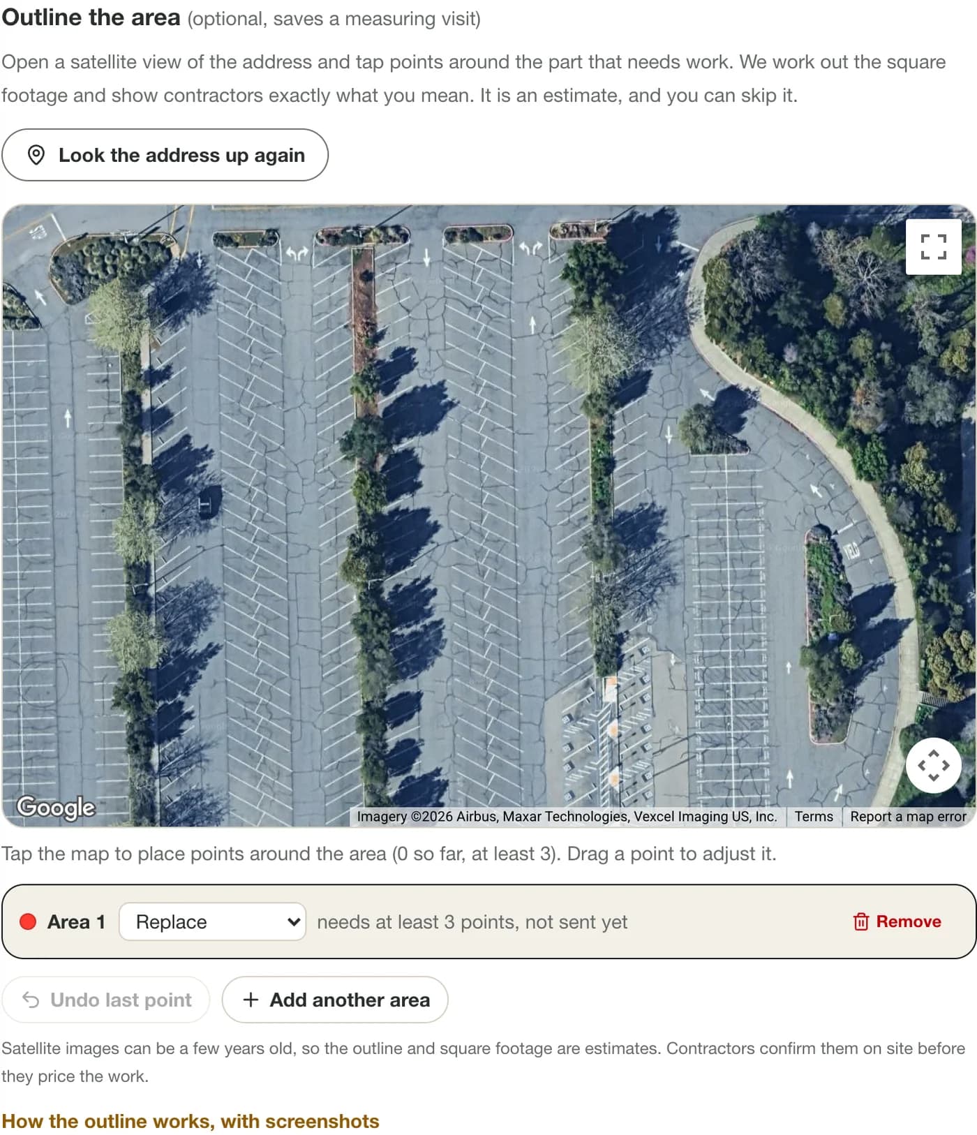 A satellite map of a parking lot and building centered on the entered address, with a button to look the address up again.